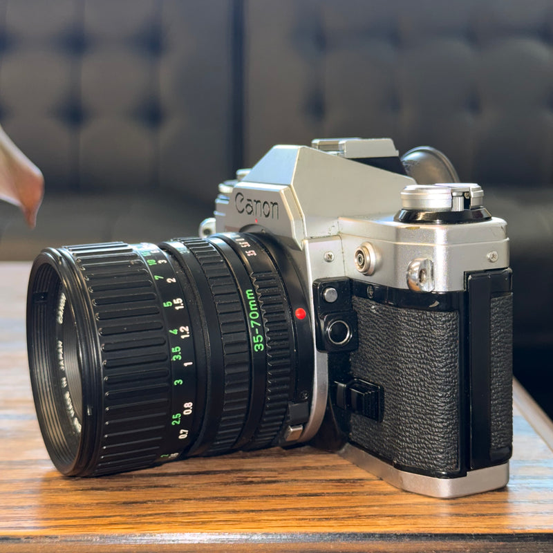 Canon AE-1 35mm SLR + Canon FD 35-70mm f/3.5-4.5 Zoom Lens