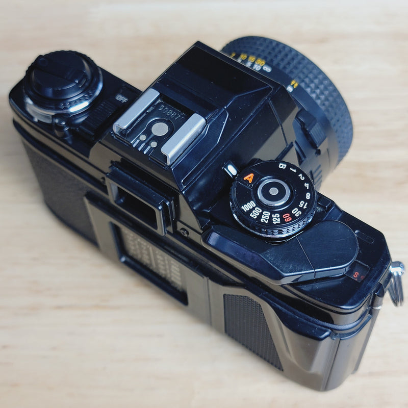 Minolta X-570 SLR with 50mm f/1.7 lens