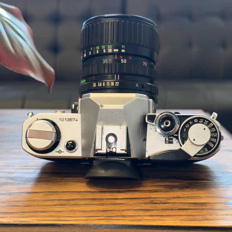 Canon AE-1 35mm SLR + Canon FD 35-70mm f/3.5-4.5 Zoom Lens